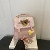 Mochila nueva de dibujos animados, diseño versátil de lunares, bolso bandolera de un solo hombro de moda 2026, estilo nicho para ir al trabajo, colección de otoño para mujer