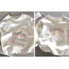 Camiseta Longa Feminina Estilo Novo Primavera/Outono 2026, Algodão Puro 40 Fios, Estilo Cartoon, Top para Bebê, Camada Base, Item Mais Vendido