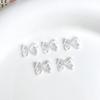 Joyería de moño para uñas nueva tridimensional estilo Joker hada viento pera de hielo nacarado moño accesorios para uñas al por mayor
