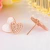 Pendientes de botón Weihua verano nuevo amor corazón blanco asimétrico temperamento de alta calidad simples frescos imitación de concha blanca pendientes de botón