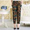 Primavera y verano más fertilizante para aumentar los pantalones cortos de seda helada de mujer de mediana edad bloomers leggings casuales fabricantes venta al por mayor