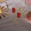 Líneas de oreja de borla de amor rojo 2023 nuevo moderno de alta gama lujo ligero largo cara redonda elegante pendientes elegantes para mujeres
