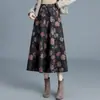 Saia de lã elegante e estilosa para mulheres, nova saia estampada de cintura alta emagrecedora para o outono e inverno de 2026, saia de comprimento médio com barra ampla, moderna