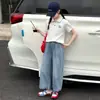 Conjunto de Verano para Niñas 2026 Nuevo Casual Estilo Coreano para Niños Mayores, Top de Manga Corta con Cuello Polo y Pantalones de Mezclilla Conjunto de Dos Piezas