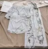 Pijama de manga larga acanalado de seda helada con copas en el pecho para mujer, nuevo estilo primavera y otoño 2026, conjunto casual de ropa para casa con estampado de gato de dibujos animados