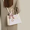 Bolsa de Mujer de Brocado Zhuang de Guangxi Patrimonio Cultural Inmaterial Bolsa Grande para Mamá Modelo Nuevo 2026 Estilo Único Bolso de Hombro Cruzado Bolso de Mano