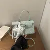 Estilo Coreano Sistema Coreano Transfronterizo 2026 Diseño de Hebilla con Estampado de Puntos Redondos Bolso de Mano para Mujer Bolso de Hombro Bolso Cruzado Bolso Cuadrado Pequeño
