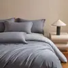Conjunto de cama de quatro peças em algodão de fibra longa estilo luxo leve, lençol de cima, lençol de baixo com elástico, capa de edredom de cor sólida em dois tons, conjunto de algodão puro