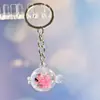 Nuevo Colgante Creativo de Bolsa con Cara Sonriente de Pulpo Brillante Dibujo Animado Pequeño Regalo Llavero de Moda Anillo de Llave