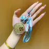 Regalos del Festival del Medio Otoño para Clientes: Pasteles de Luna, Bolsas de la Suerte, Dijes Dorados para Teléfono, Llaveros, Cadenas para Teléfono, Dijes para Bolsos