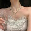 Collar de doble capa de perlas retro francesas, accesorios para mujer, pequeñas cuentas de arroz, gargantilla de cadena de clavícula de lujo ligero y de alta gama.