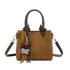 Bolso de mano retro de gamuza nuevo 2026, un diseño de nicho para mujer, con un elegante estilo de bolso tipo cubo con un aspecto sofisticado, adecuado para llevar en el hombro o cruzado