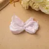Lindas rimas infantiles color crema viento seda brillante hilo ligero lazo DIY clip lateral en el clip accesorios para el cabello accesorios para la ropa al por mayor