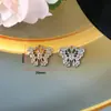 Material diy hecho a mano accesorios de aleación de pedrería mariposa flor conejo oso hebilla flor de zapato colgante de bolsa