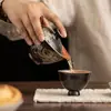 Oro y plata con marcas negras, motivo de danza del león, cuenco de té de cerámica vintage para uso doméstico, caja de regalo