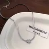 Nuevo Diseño de Alta Gama Collar Francés Diseño de Nicho Lujo Ligero Diamante Brillante Estrella de Cinco Puntas Cadena de Hueso de Serpiente para Mujer