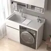 Gabinete de lavandería para balcón de aluminio tipo panal con lavadora integrada, incluyendo una tabla de lavar y un fregadero de piedra de cuarzo artificial con una barrera de agua