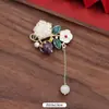 Novo broche estilo antigo de alta qualidade ins para mulheres estilo chinês leque borla pino de terno placket de pressão cheongsam corsage atacado