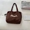 Bolsa de Ombro Shuai Mijia Estilo Coreano de Alto Valor para Axila Outono 2026 Nova Bolsa de Ombro Única com Letras Grande Capacidade Bolsa Saco Elegante