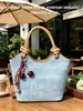 Bolso tipo cubo simple y elegante para mujer, Nuevo bolso de mano de moda versión coreana Primavera 2026, Bolso de hombro y cruzado