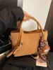 Cesta de Verduras Retro Bolso Pequeño para Mujer 2025 Nuevo Bolso de Mano Mate Bolso Cubo Otoño e Invierno Moderno Bolso Cruzado de Gamuza