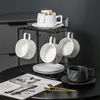 Juego de Tazas de Café de Cerámica con un Diseño de Lujo Ligero, Alto Valor Estético y Diseño Único para Uso Doméstico, Incluyendo una Taza con Asa Colgante y Platillo