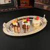 Bandeja metálica ovalada de estilo europeo con motivos florales de colores esmaltados, adecuada para servir fruta, como bandeja de té en hoteles, o para guardar frutos secos.; una pieza decorativa para la decoración del hogar