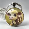 Serie de Llaveros con Diseño Creativo de Venta Caliente Transfronteriza Vaca con Relieve Rosa de las Tierras Altas Colgante para Bolso de Aleación de Gema del Tiempo