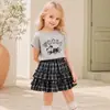 Conjunto de Dos Piezas para Niños Mayores: Camiseta de Manga Corta con Perro Dachshund Estilo Nuevo Verano 2026 + Falda de Tartán de Cuadros - Atuendo de Moda Tendencia