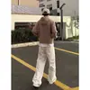 Jeans masculinos da moda de alta qualidade em estoque de fábrica com bordado de cabeça de tigre branca, corte slim e perna afunilada