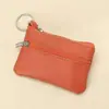 Billetera pequeña de color sólido de piel de vaca de capa superior, monedero portátil, mini ultra-delgada de cuero con cremallera, monedero para mujer, venta directa de fábrica
