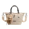 Bolso Pequeño de Nailon Versátil Casual para Mujer 2025 Nuevo Bolso de Hombro Cruzado Simple Bolso de Mano de Moda Bolso Dumpling