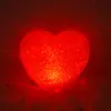 Sosteniendo Amor luz estribillo accesorios corazón rojo en forma de grano de arroz luz nocturna accesorios para actuación en escenario venta al por mayor