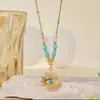 Populares Collares Europeos y Americanos de Acero de Titanio, Colgantes Triangulares de Turquesa Galvanizados que no se decoloran de Dongguan, Aretes de Ojo de Diablo
