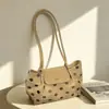 Bolso japonés textura simple bolso de hombro individual coreano gran capacidad 2026 nuevo otoño gamuza axila exquisito