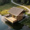 Casa de campo escénica de madera móvil con balcón al aire libre, cabaña de acero ligero para acampar y vacaciones junto al lago en zonas escénicas