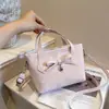 Bolso cubeta de lunares con lazo estilo dulce y femenino para mujer, bolso de mano 2026 nuevo de moda de verano, bandolera versátil