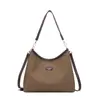 Bolso de Axila de Alta Gama de Nicho para Mujer 2025 Nuevo Versátil Bolso Cubo de Lona Simple Bolso de Hombro Cruzado