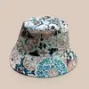 Novo estilo exótico combinação de cores padrão chapéu de pescador masculino e feminino retrô viagem proteção solar dupla face personalidade chapéu balde atacado