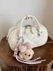 Bolsa Versátil de Grande Capacidade Transfronteiriça para Mulheres Nova Tendência da Primavera 2026 Moda Casual Nicho Bolsa de Ombro Transversal