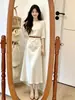 Los atuendos para mujeres petite lucen geniales: Conjunto de Top y Falda para Mujer, Nuevo Estilo Verano 2026, Impresionante y Elegante Conjunto de Dos Piezas