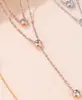 Collar de doble capa de acero de titanio para mujer, verano, oro rosa, cadena para la clavícula que no se decolora, collar de estilo frío, temperamento de lujo ligero, colgante pequeño
