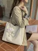 Popular bolsa de trabajo y para ir al trabajo estilo coreano para mujer, nuevo bolso de hombro de moda versátil para el verano de 2026, bolsa de mano de gran capacidad