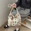 Nuevo bolso de hombro bordado estilo chino para mujer 2026 nuevo estilo étnico moderno versátil bolso cruzado tipo cubo