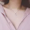 Collar de amor sencillo de estilo japonés y coreano, cadena de clavícula con astas cruzadas, flor, perla y colgante de latido de corazón de celebridad cibernética.