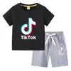 Camiseta infantil 2022 TikTok verano nueva ropa infantil de comercio exterior coreana pantalones cortos de manga corta para niños traje de dos piezas