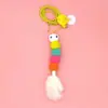 Juguetes para gatos de hi swing juguetes colgantes para puerta plumas elásticas colgantes palo para gatos campana tiembla una generación de pelo