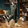 Pantalones de trabajo lavados al agua marca de moda pantalones de chándal desgastados para hombre peso pesado retro casual pantalones para hombre con puños forrados de forro polar pantalones largos de senderismo