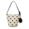 Bolso de hombro para mujer con un estilo delicado, bolso de mano de lunares, bolso de axila minimalista de nicho, bolso tote de hombro casual para estudiante y viajero