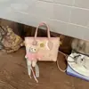 Bolso de mujer de nicho estilo extranjero, nueva moda 2026, bolso de mano pequeño súper popular para el trabajo, bolso de hombro y cruzado tipo cubo